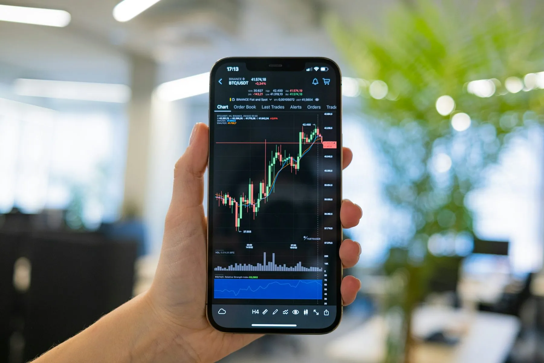 Crypto trader investor analyst businessman using mobile phone app analytics for cryptocurrency financial market analysis