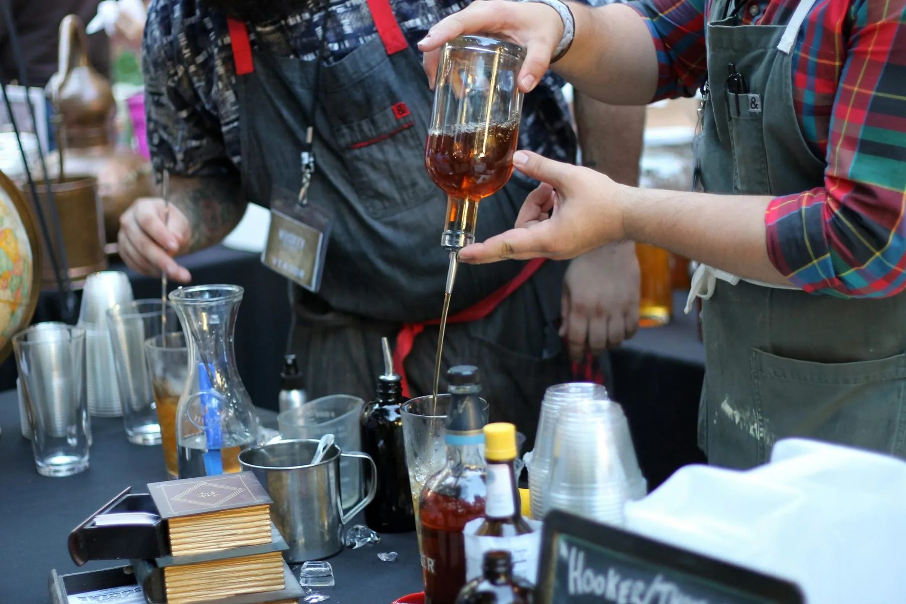 Bartenders preparing drinks at a bar